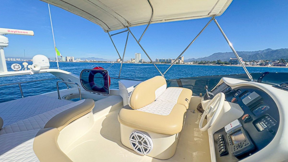 Helm and flybridge seating of an Azimut 52 available for yacht charter in Puerto Vallarta from Marina Vallarta